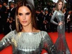Alessandra Ambrosio slinks onto the Cannes red carpet in a movie star-worthy metallic gown