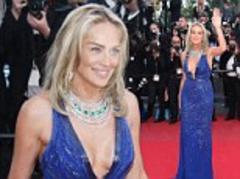 Sharon Stone, 55, steals the show in a plunging cobalt blue gown at Behind The Candelabra Cannes premiere