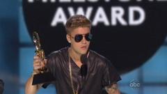 justin bieber: a place where chris brown, jon bon jovi, and judd apatow meet