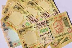 rupee up marginally by 6 paise at 55.35 against dollar