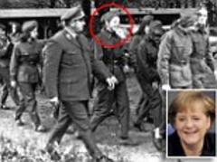 Angela Merkel under fire over Communist links as new image of her in uniform is released